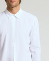 All White Long Sleeve Performance Dress Shirt on a person.