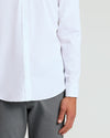 All White Long Sleeve Performance Dress Shirt showcased on a person.