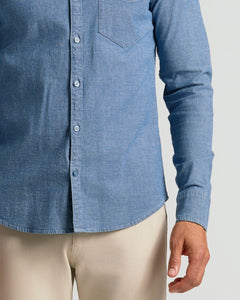 True ClassicLight Indigo Wash Long Sleeve Chambray Shirt tucked into khaki pants.
