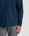Navy Long Sleeve Linen Shirt worn untucked with gray trousers.