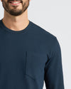 Man wearing Navy Heavyweight Long Sleeve Pocket Crew, smiling with visible chest pocket.