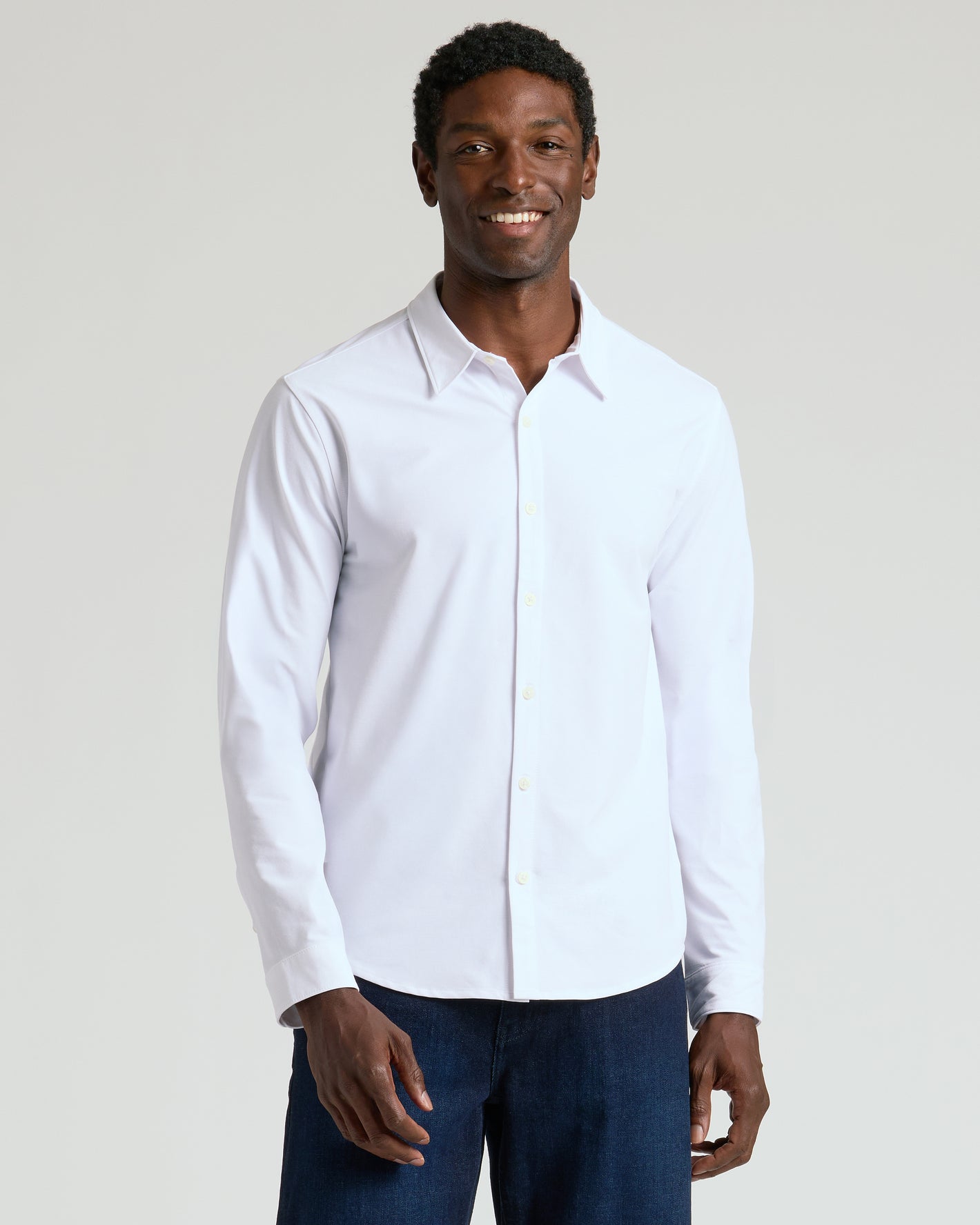 Man wearing Standard Long Sleeve Modern Knit Oxford, showcasing business casual style.