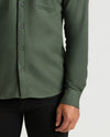 Woodland Long Sleeve Flannel Shirt, dark-green, button-front, paired with black pants.