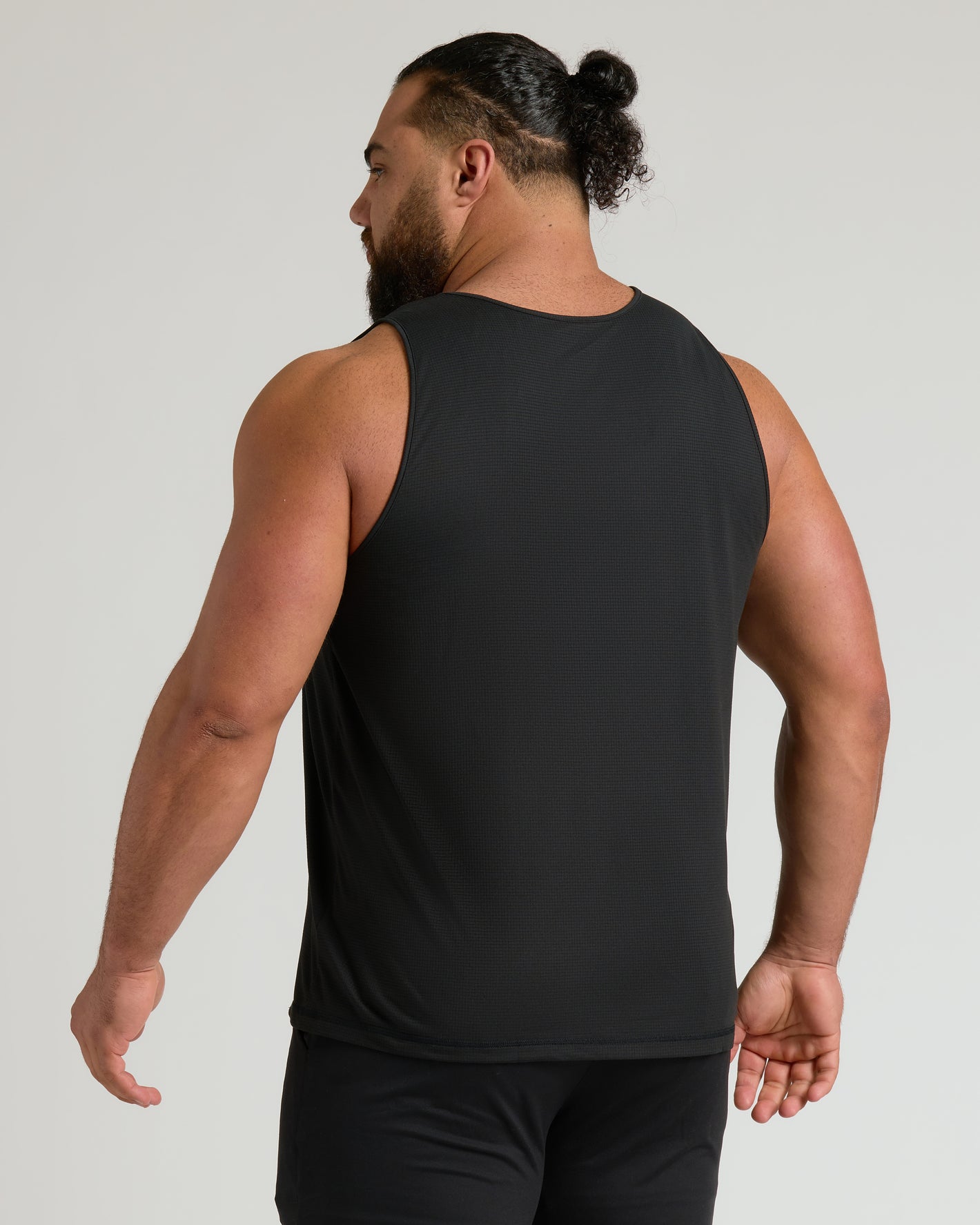 Back view of man in Black & Navy Active Mesh Tank.