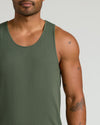 Man wearing Kelp Sleeveless Active Mesh Tank with insect tattoos visible.