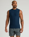 Model wearing The Timeless Sleeveless Active Muscle Tee in navy, showcasing athletic fit.