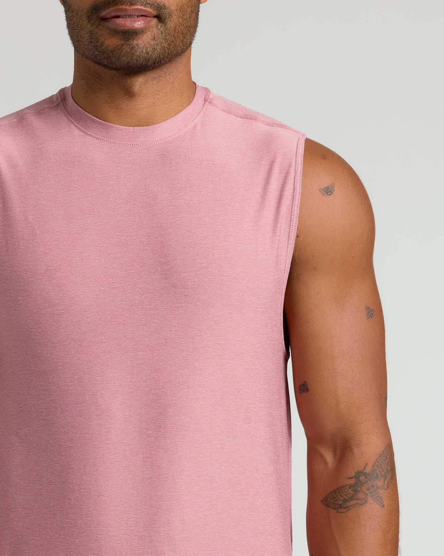 Quartz Rose Sleeveless Active Muscle Tee with insect tattoos visible on arm.