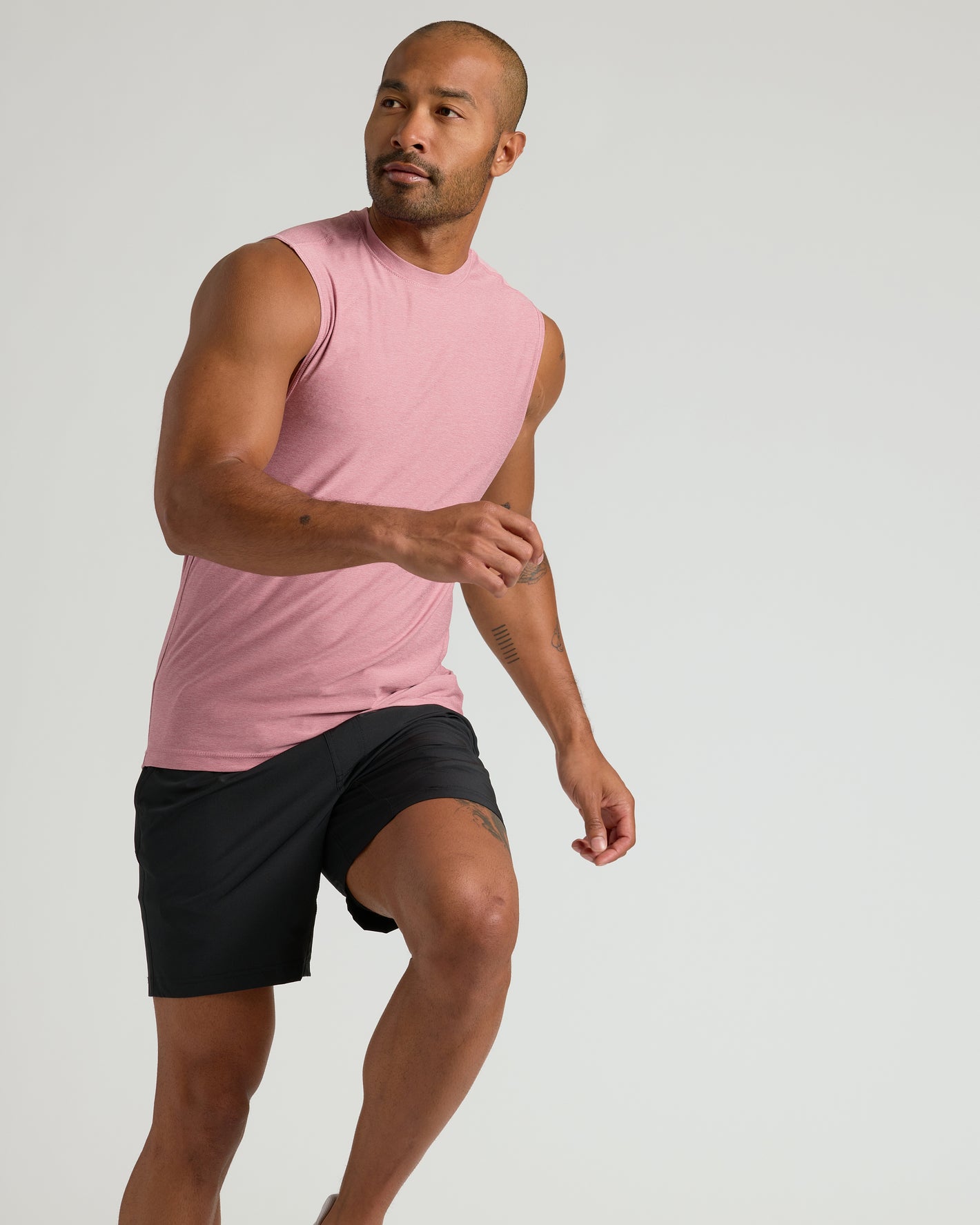 Quartz Rose Sleeveless Active Muscle Tee worn by fit man in motion.