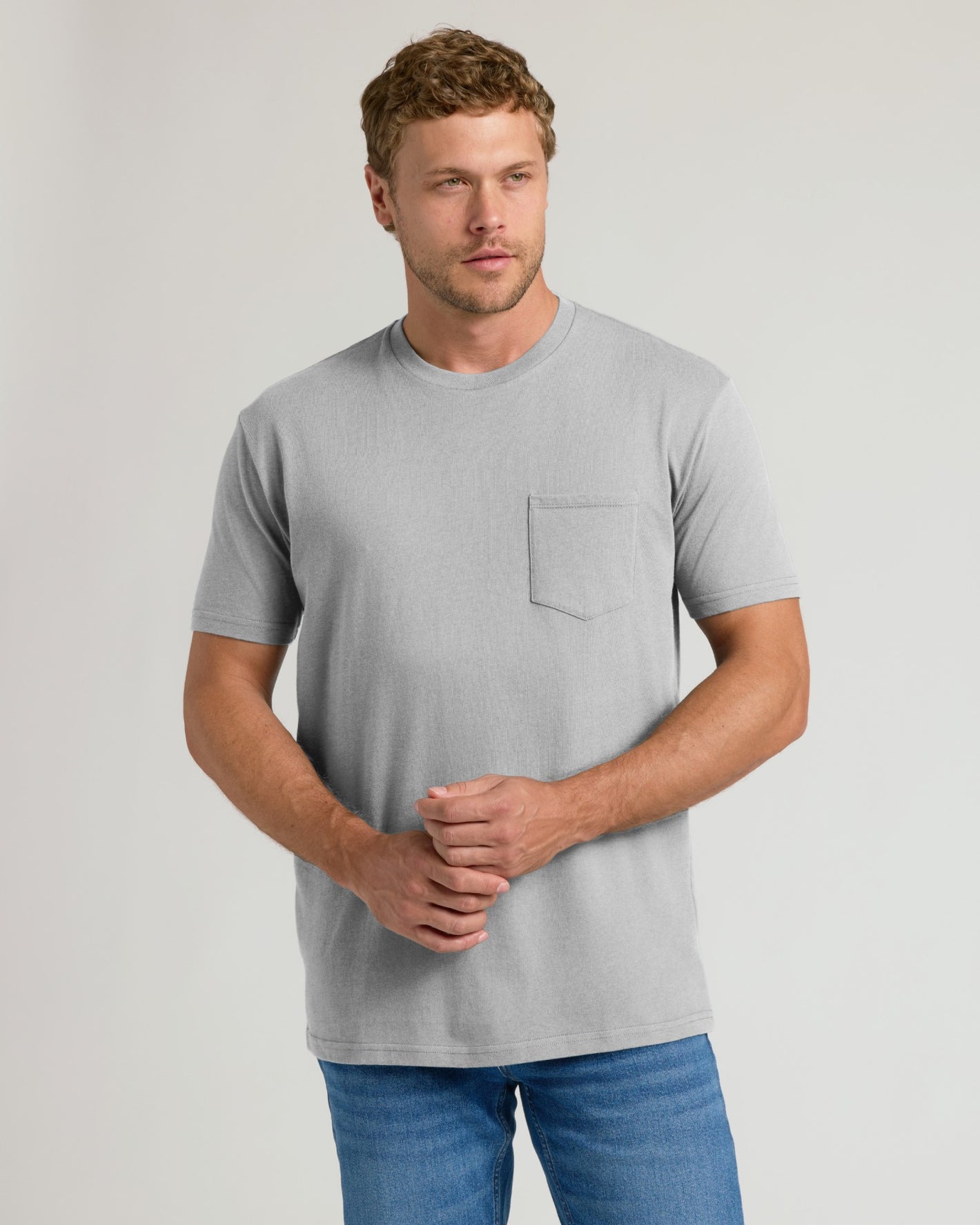 Man wearing Classic Pocket Crew 3-Pack t-shirt and jeans.