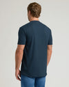 Back view of model in Navy Pocket Crew Tee and medium-wash jeans.