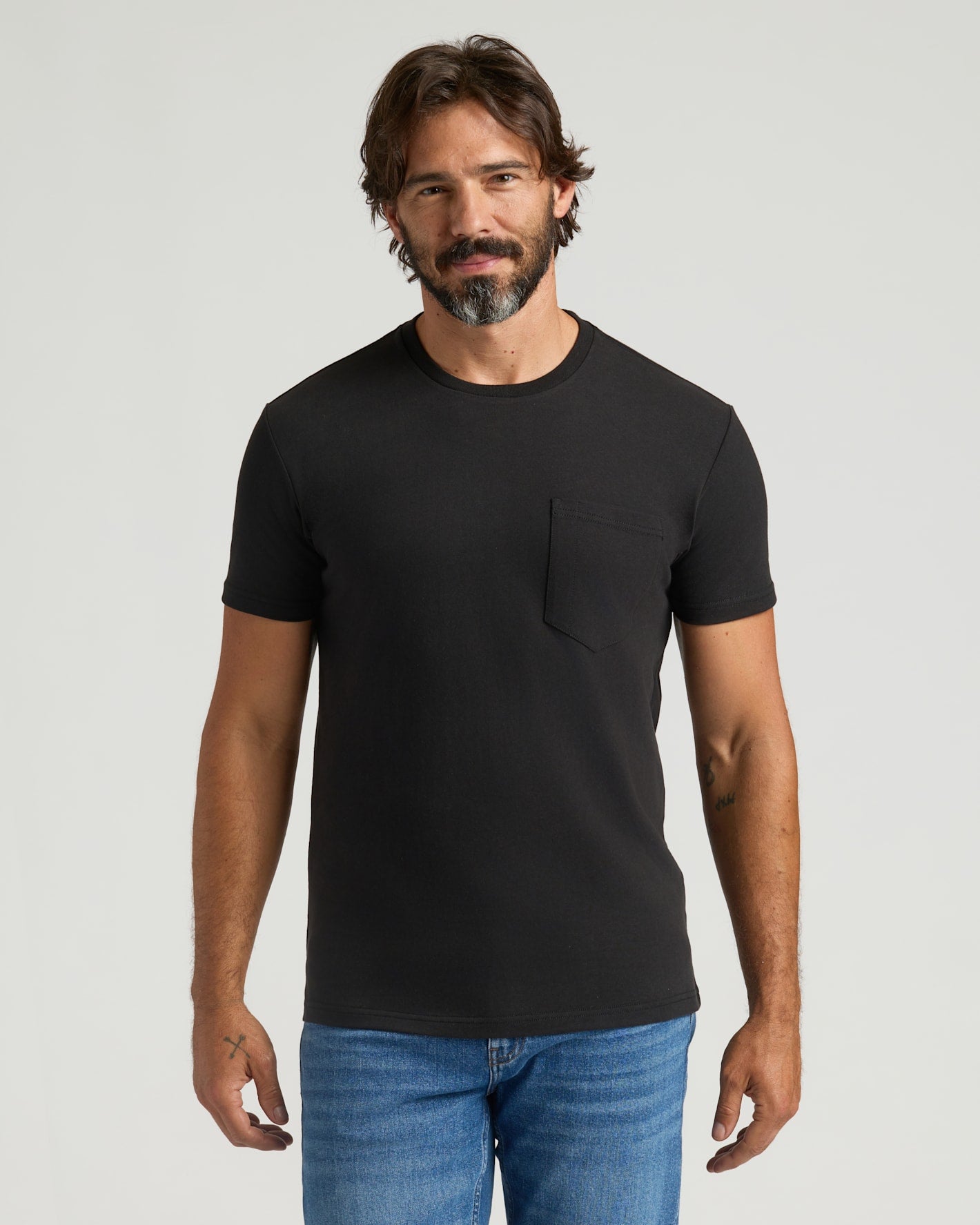 Man wearing Black Heavyweight Pocket Crew, showcasing its durable design.