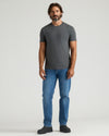 Man wearing Heavyweight Pocket Crew T-shirt with jeans and black shoes.