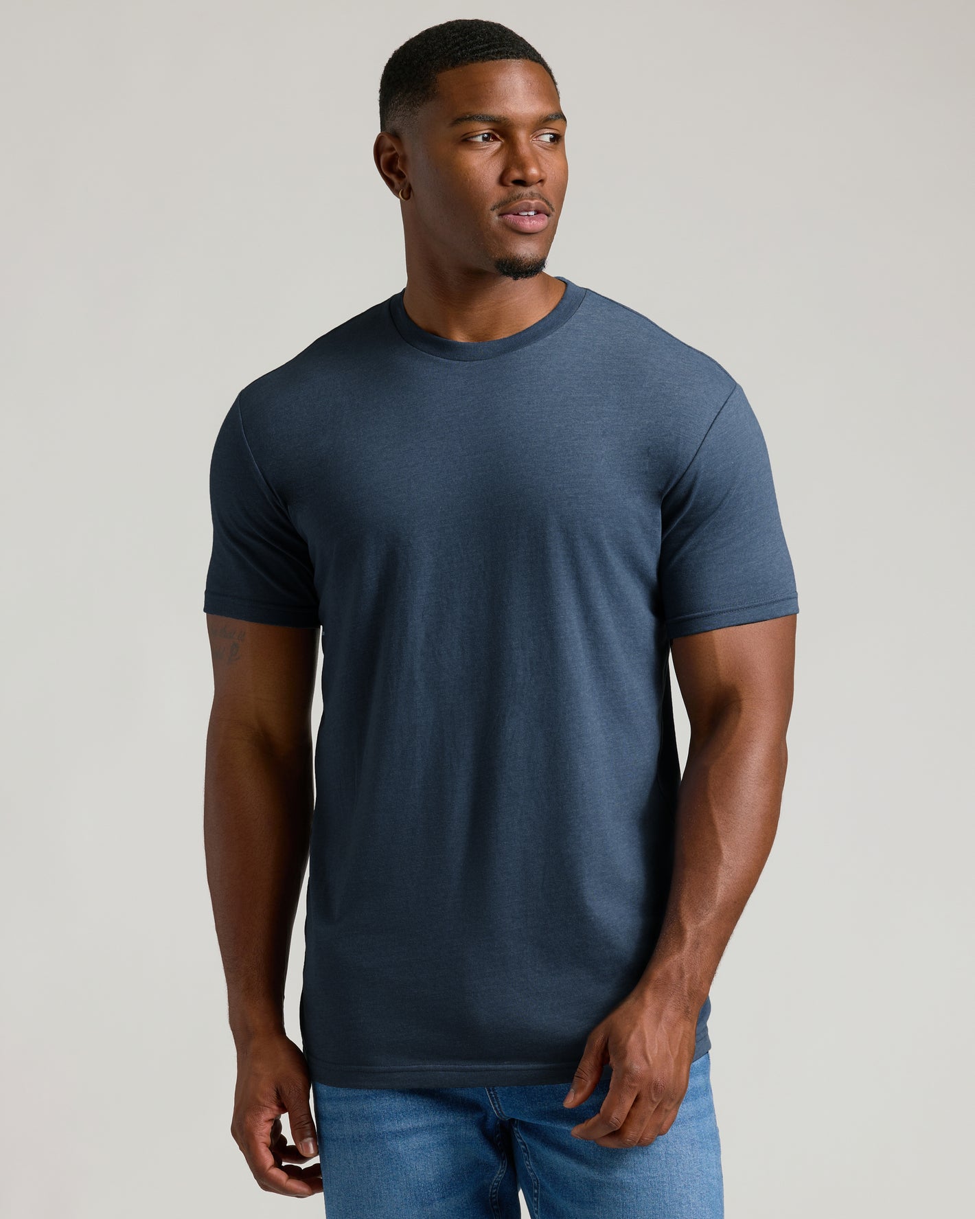 Young man in Heather Navy Tall Straight Hem Crew Neck T-Shirt.