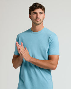 True ClassicHeather Voyager Short Sleeve Tall Crew worn by a relaxed man.