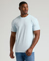 Male model in Seasonal Tall Straight Hem T-Shirt, pale blue, with blue jeans.