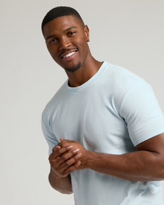 True ClassicIcicle Tall Straight Hem Crew Neck T-Shirt on smiling man.