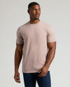 Man wearing Seasonal Tall Straight Hem T-Shirt in beige with dark jeans.