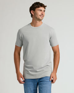 True ClassicYoung man in Steel Tall Straight Hem Crew Neck T-Shirt, smiling.