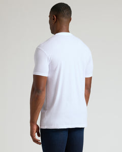 True ClassicAll White Tall Classic Crew 10-Pack worn with dark blue jeans.