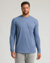 Model wearing Seasonal Tall Classic Long Sleeve Crew, blue shirt, gray pants.