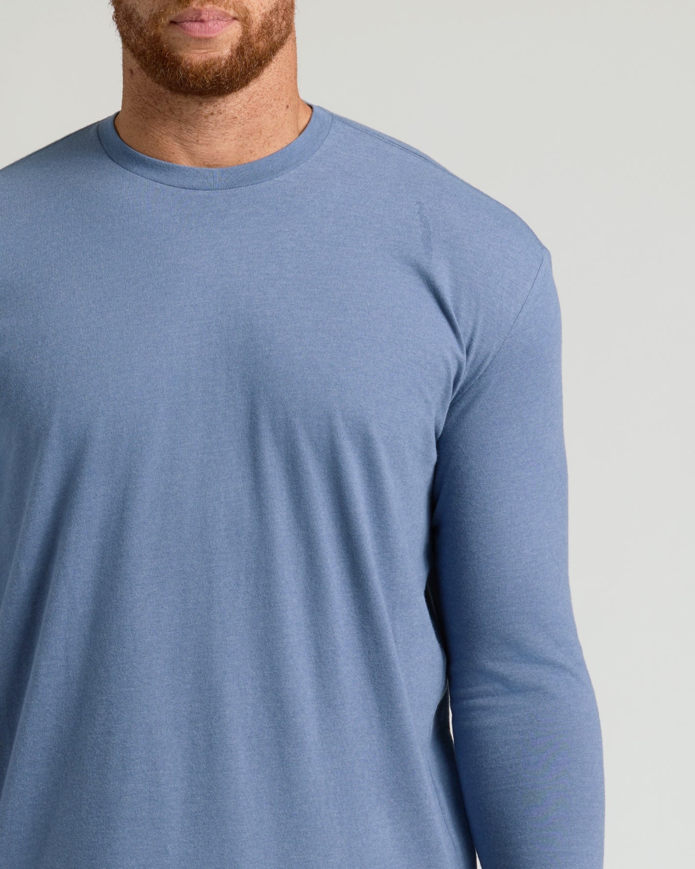 Man wearing Dark Heather Vintage Navy Tall Long Sleeve T-Shirt.