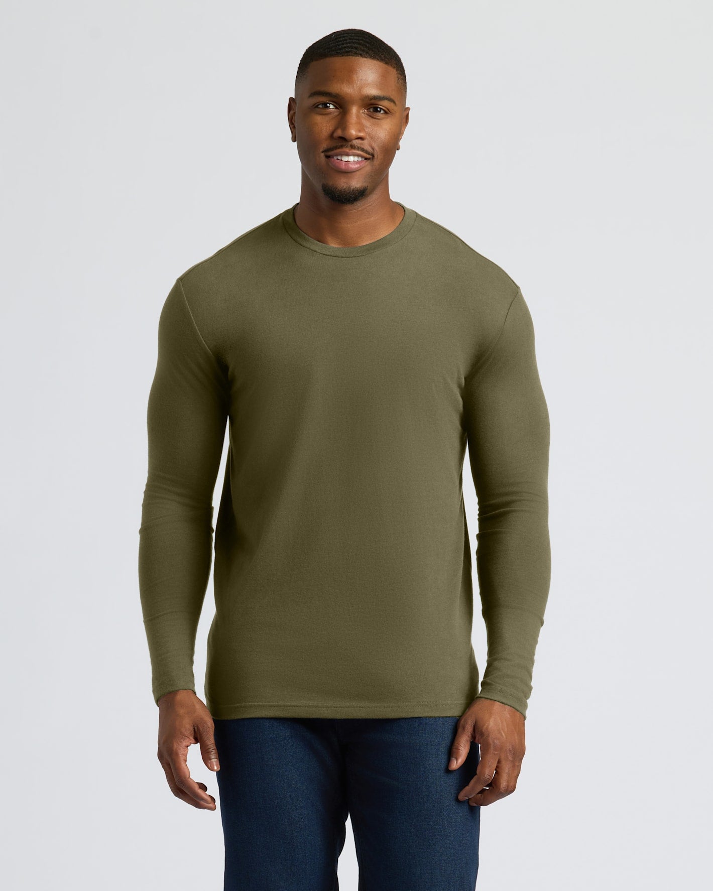 Military Green Tall Long Sleeve T-Shirt on a smiling young man.
