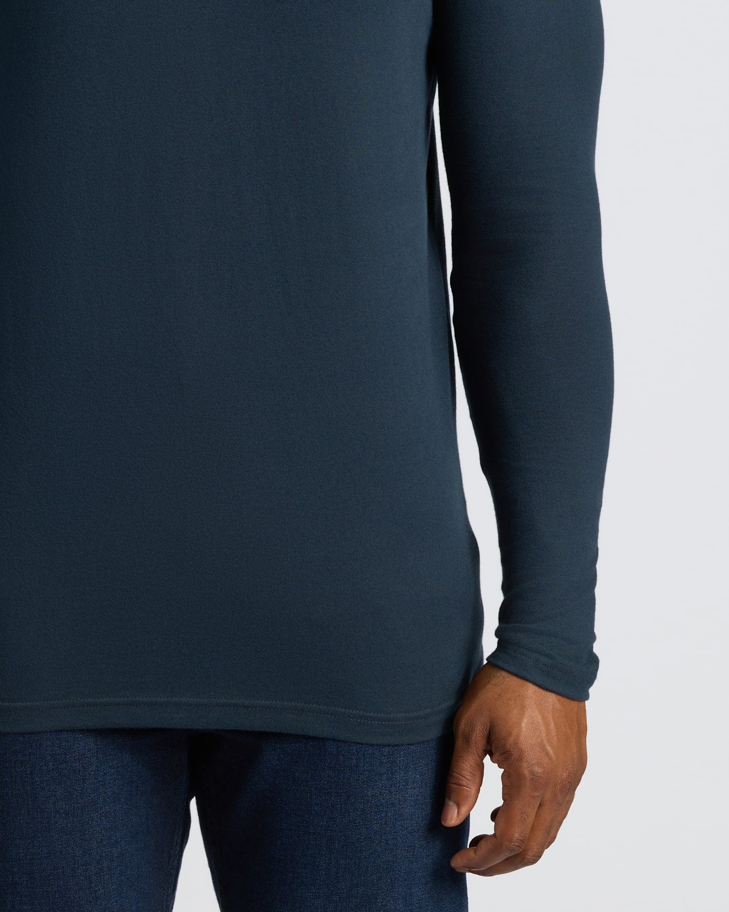 Navy Tall Long Sleeve T-Shirt on person’s midsection.