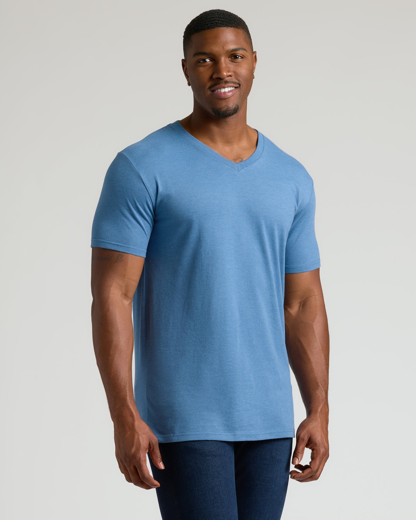 Young man modeling the Seasonal Tall Classic V-Neck 6-Pack shirt.