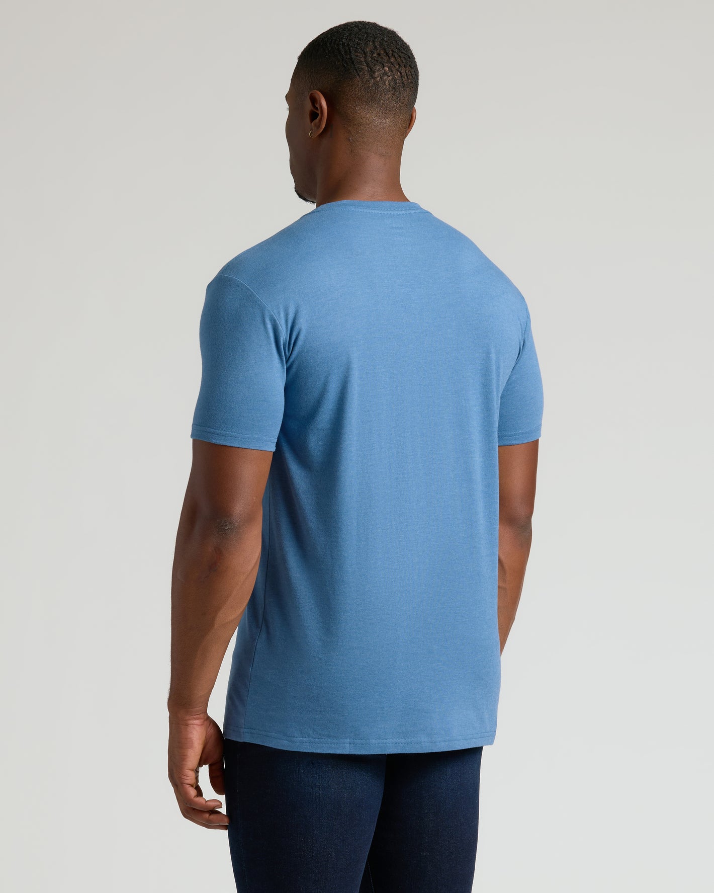 Back view of man in Dark Heather Blue Lake Tall Classic V-Neck.