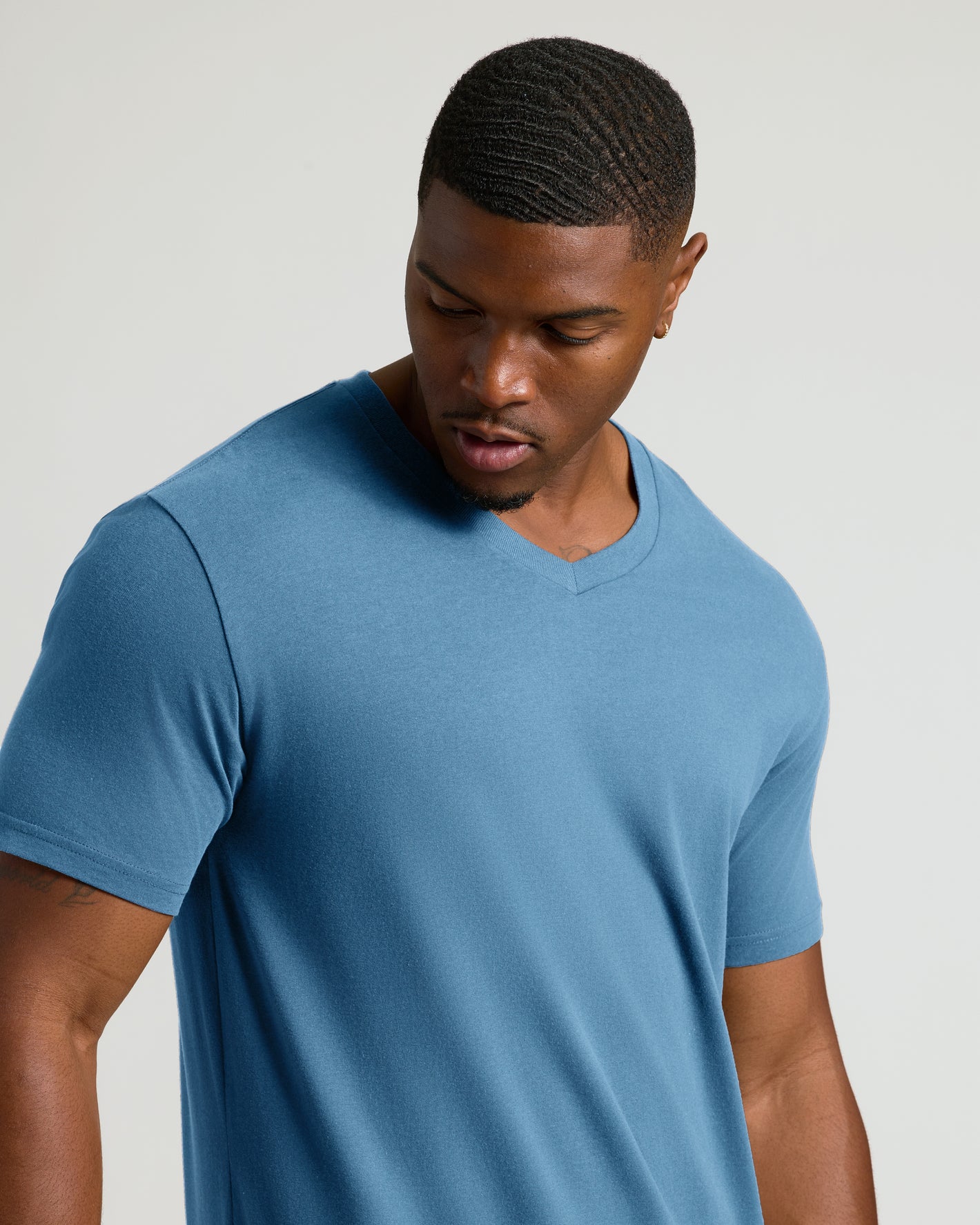 Indigo Tall Short Sleeve Classic V-Neck on young man with wavy hair.