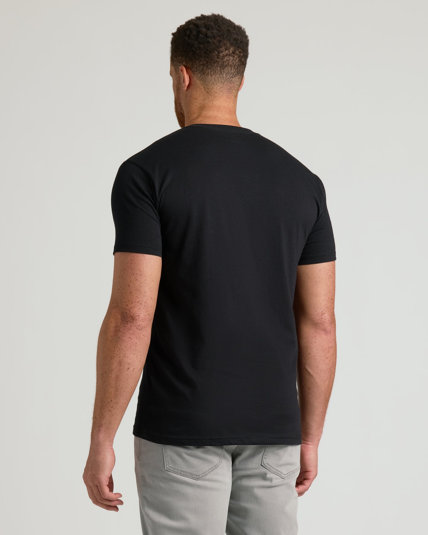 Black Short Sleeve Tall Classic V-Neck 3-Pack worn by freckled man.