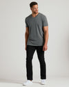 Man wearing Carbon Tall Short Sleeve Classic V-Neck with black pants and sneakers.