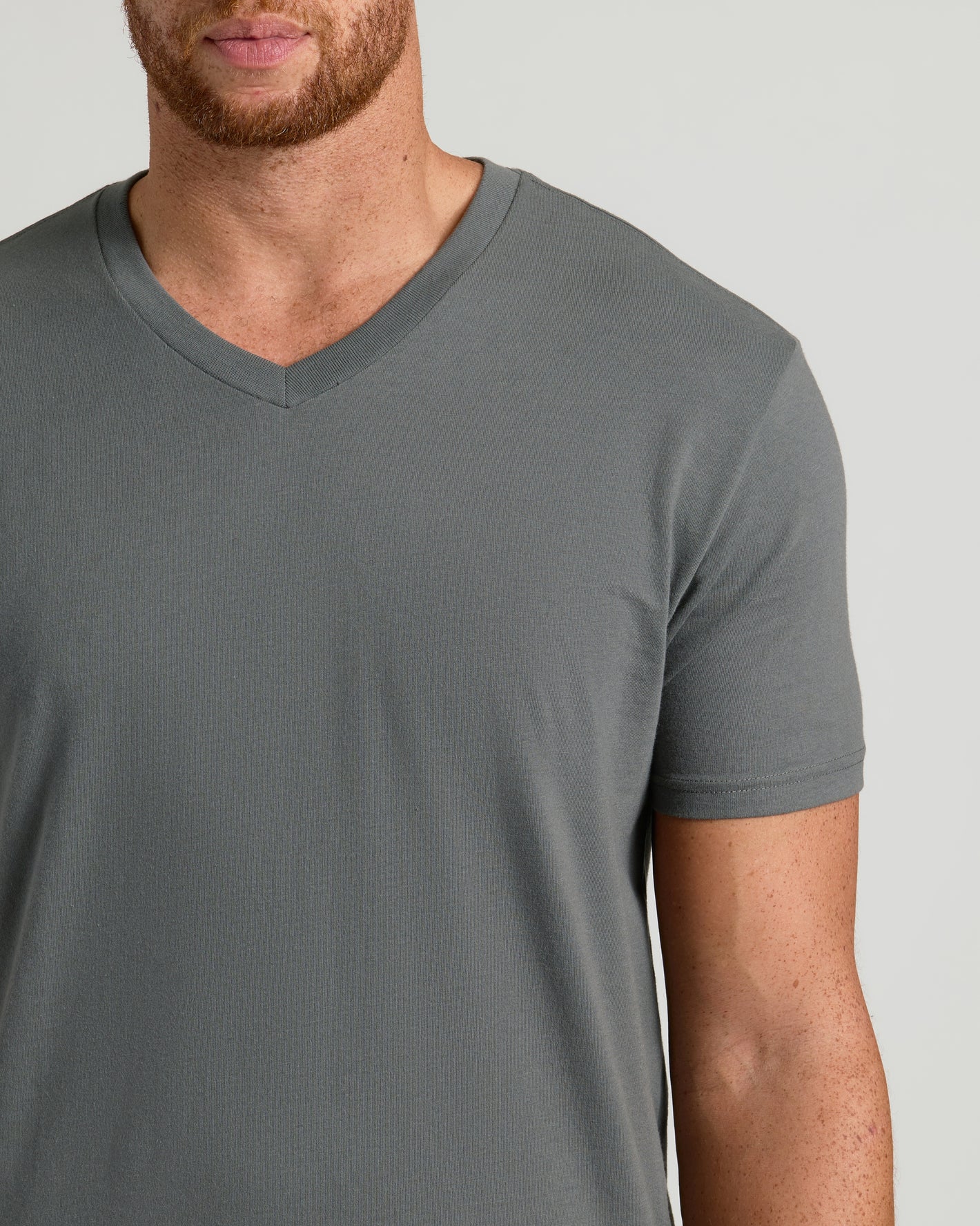 Man wearing Carbon Tall Short Sleeve Classic V-Neck T-shirt, tailored fit.
