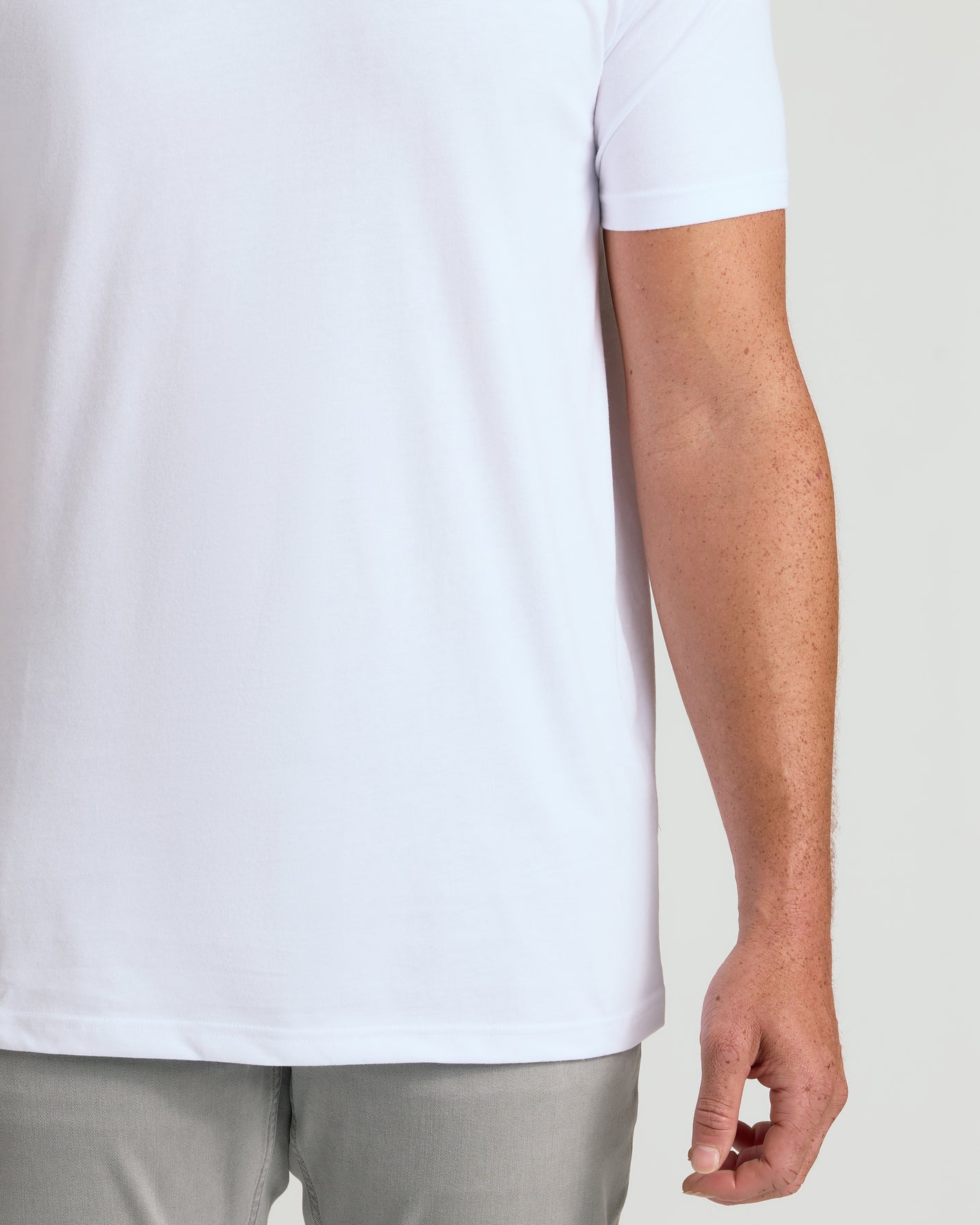 White Classic Tall V-Neck 10-Pack on model, showcasing longer, tailored fit.