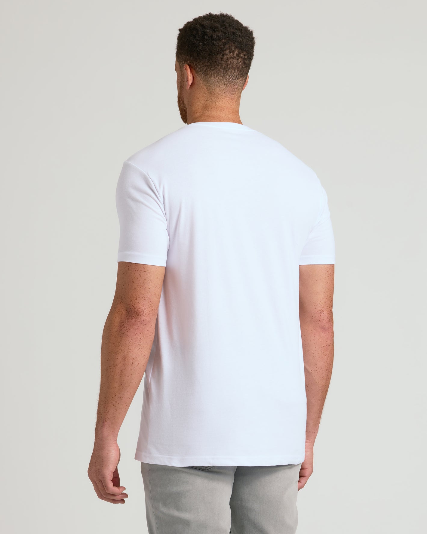 White Classic Tall V-Neck 10-Pack on man, showcasing tailored fit.