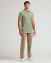 Man in Dark Heather Bay Green Short Sleeve Tall Polo, khaki trousers.