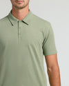 Man in Dark Heather Bay Green Polo, showcasing collar and texture.