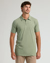 Man modeling Dark Heather Bay Green Short Sleeve Tall Polo.