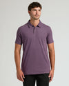 Young man in Dark Heather Plum Short Sleeve Tall Polo.