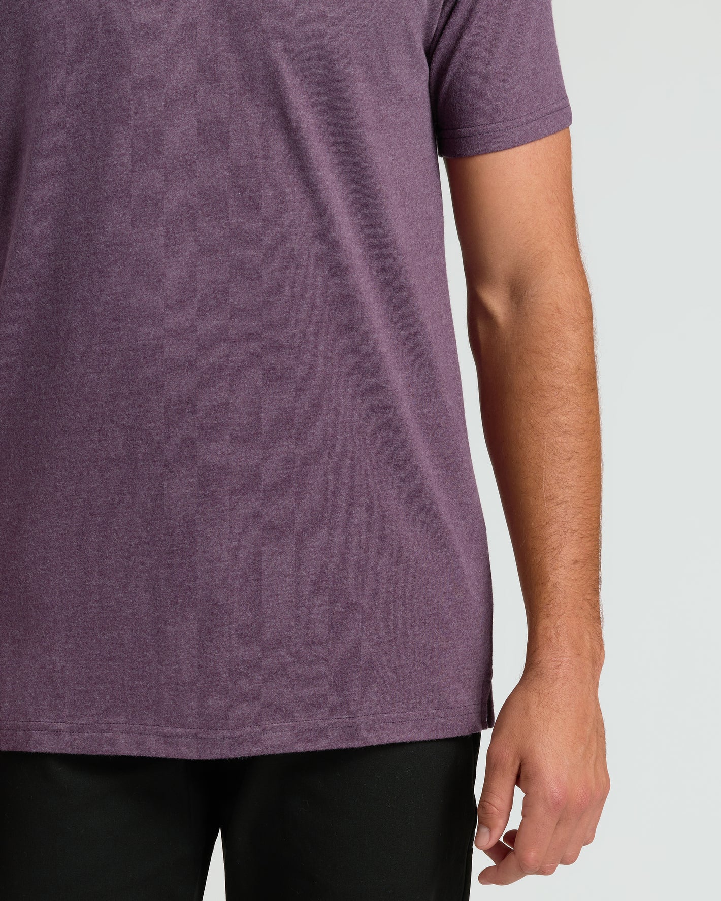 Dark Heather Plum Short Sleeve Tall Polo worn with dark pants.
