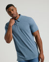 Young man in Dark Heather Tempest Short Sleeve Tall Polo.