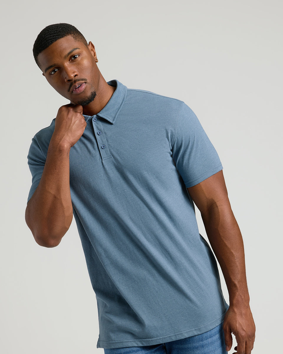 Young man in Dark Heather Tempest Short Sleeve Tall Polo.