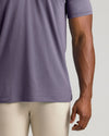 Dark Heather Amethyst Short Sleeve Tall Polo worn with light-beige pants.