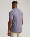 Man wearing Dark Heather Amethyst Short Sleeve Tall Polo from the back.