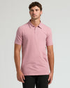 Model in Seasonal Tall Classic Polo 6-Pack, heathered-pink, short-sleeve.