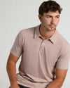 Young man in Light Heather Slate Mauve Short Sleeve Tall Polo.