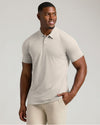Man in Seasonal Tall Classic Polo 3-Pack, oatmeal color, smiling.