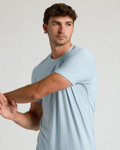 True ClassicArctic Tall Active Crew Neck 2.0 worn by man stretching.