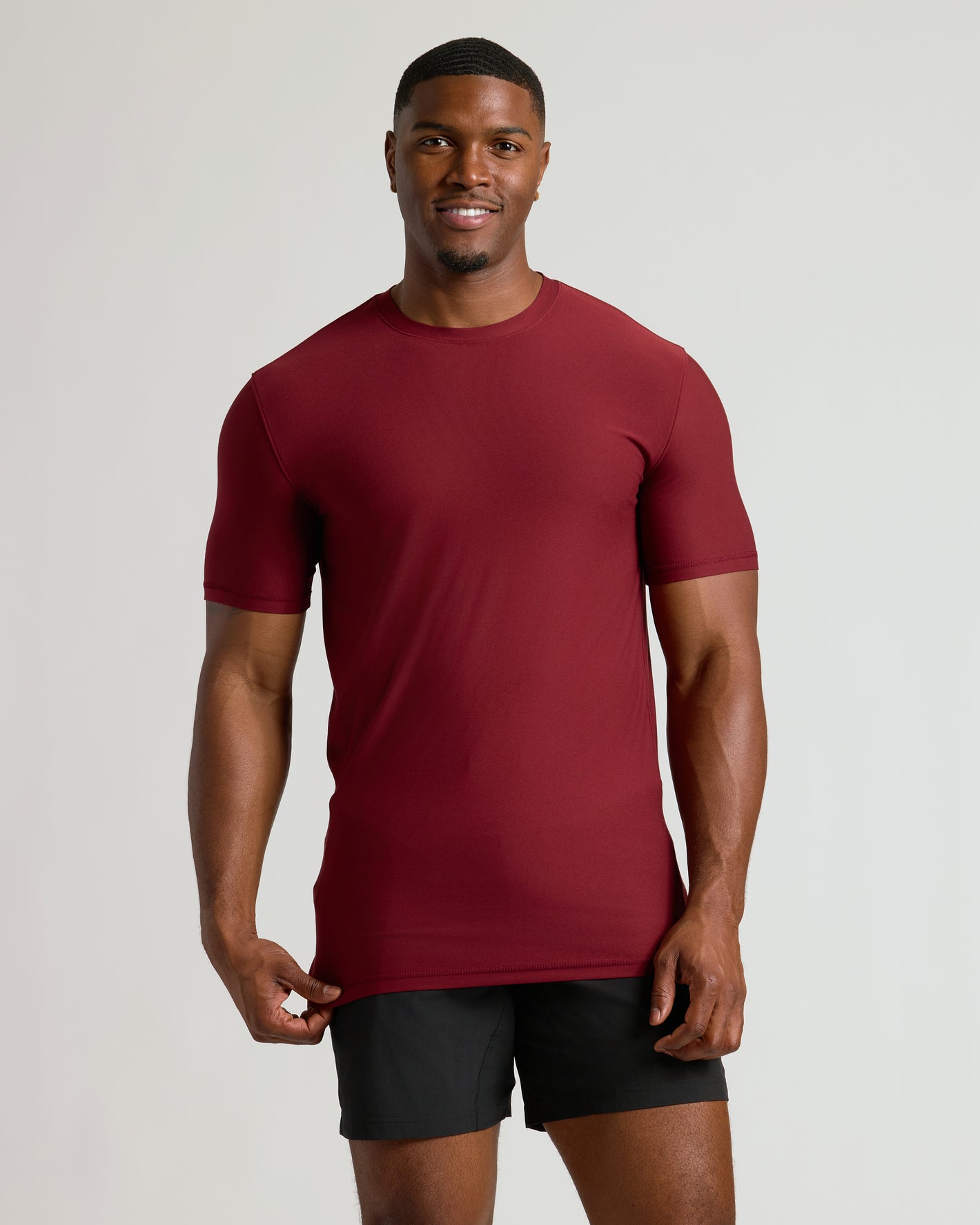 Man modeling Seasonal Tall Active Crew 3-Pack T-shirt and shorts.