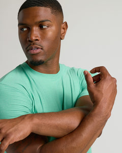 True ClassicFern Tall Active Crew Neck 2.0 on young man, arms crossed.